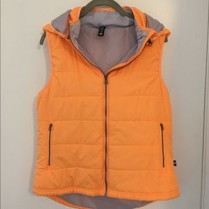Lightweight puffy orange and gray vest.
